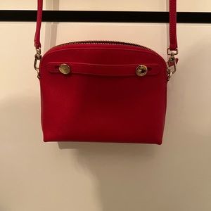 Red furla bag.